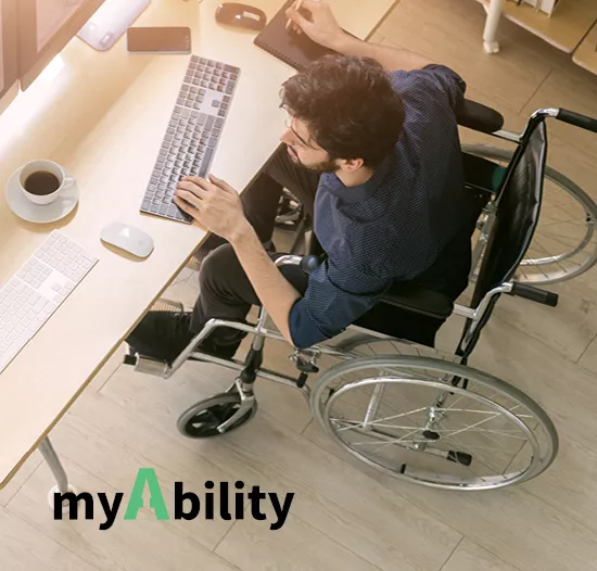 man in wheelchair working